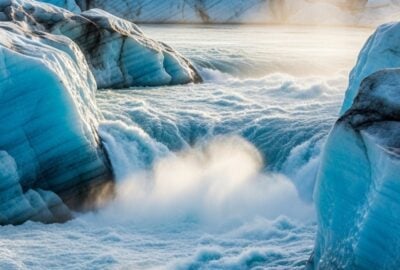 Massive turquoise meltwater river carving through the Greenland ice sheet surface