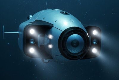 Autonomous underwater drone scanning dark seafloor searching for abandoned ghost fishing net