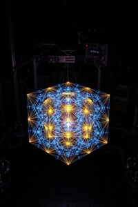 Glowing photon lattice forming a crystalline structure inside a dark physics laboratory