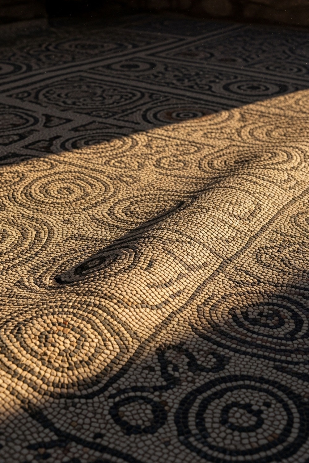 Ancient Roman mosaic floor showing subtle seismic ripple across colorful geometric tesserae