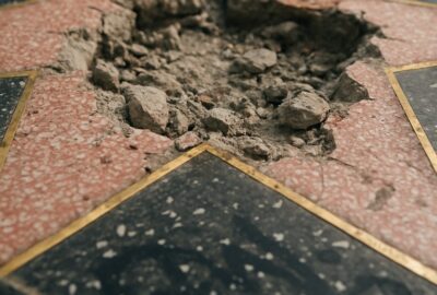 Trump's Hollywood Walk of Fame star smashed open showing broken pink terrazzo and rubble