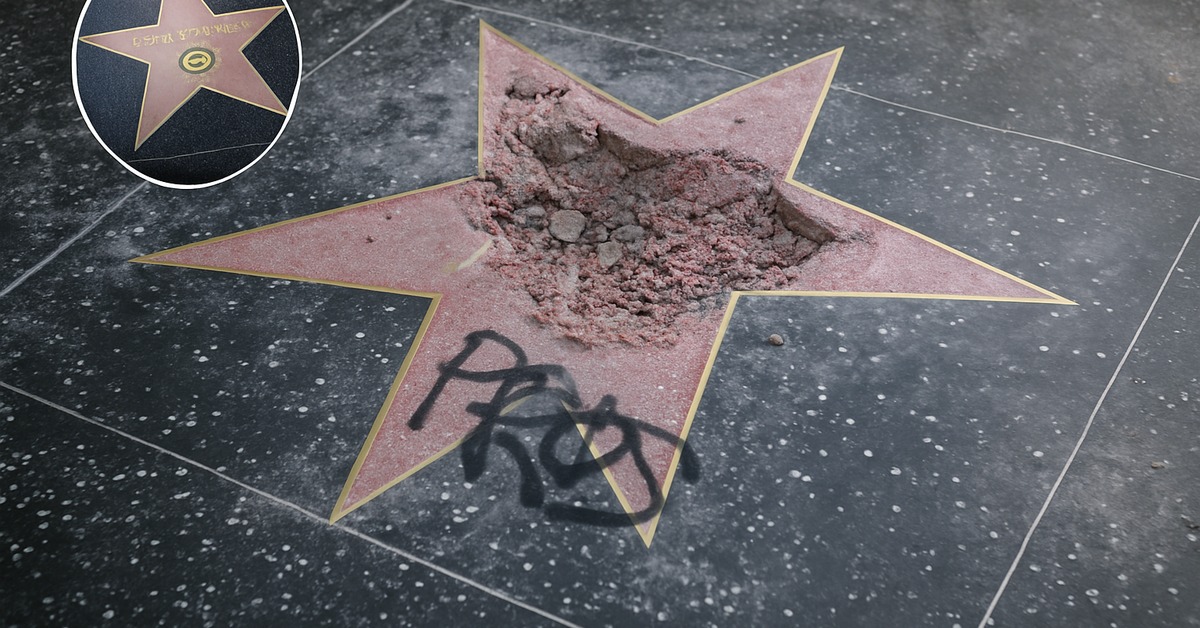Wide-angle view of damaged Trump star surrounded by broken terrazzo and debris