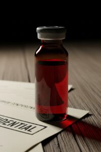Glass vial containing stolen Coca-Cola product sample seized by FBI agents during sting operation