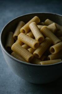 Close-up of cold leftover pasta in a bowl showing starch transformation science