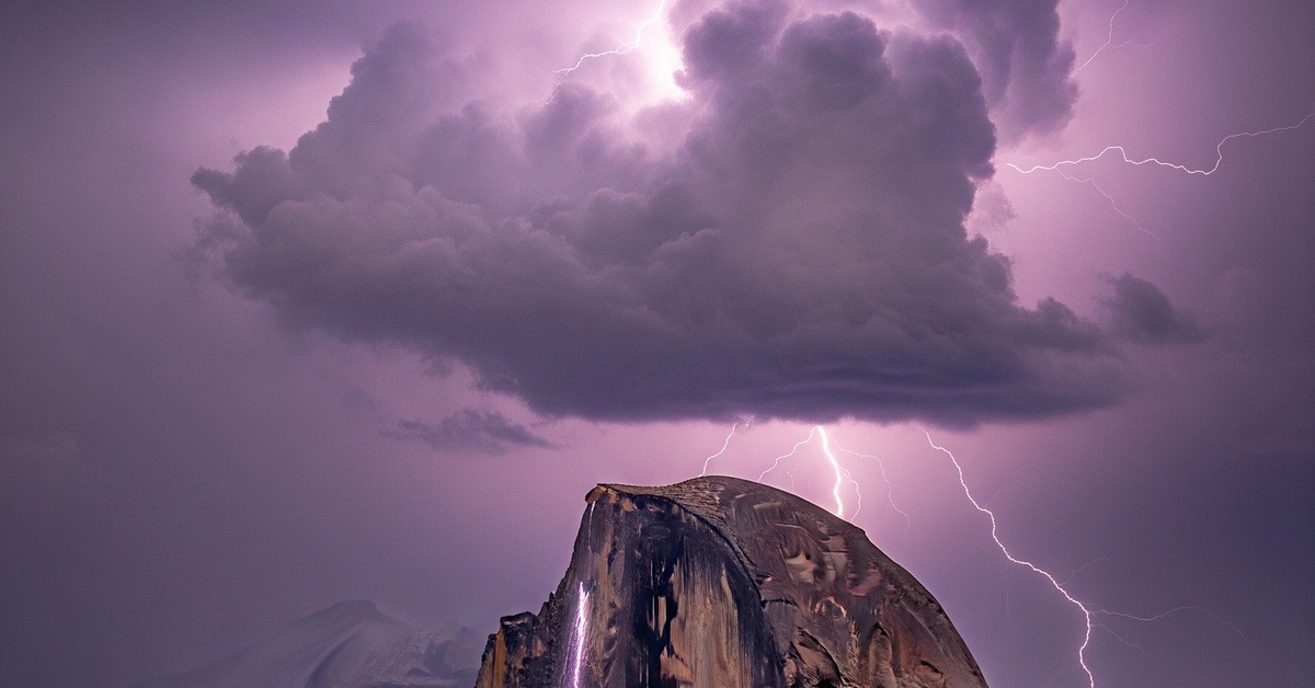 Dramatic storm clouds gathering over the exposed granite dome of Moro Rock