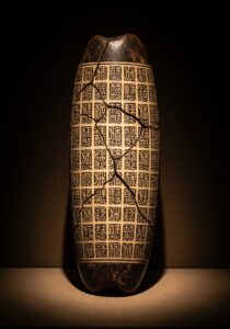 Ancient Chinese oracle bone inscriptions carved into a turtle plastron — the oldest continuously used writing system on Earth.