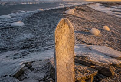 The frozen gravel of Beechey Island in the high Canadian Arctic, where three Franklin expedition sailors were buried in 1846