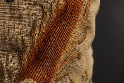 Close-up of the Halley's Comet Bayeux Tapestry scene — an embroidered hairy star on aged linen