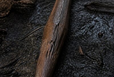 How old are the Schöningen spears — a preserved Palaeolithic wooden throwing spear of spruce laid on dark excavation sediment