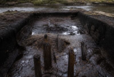 Waterlogged peat-bog excavation at Monte Verde, southern Chile, where preserved ancient wood and organic material were recovered